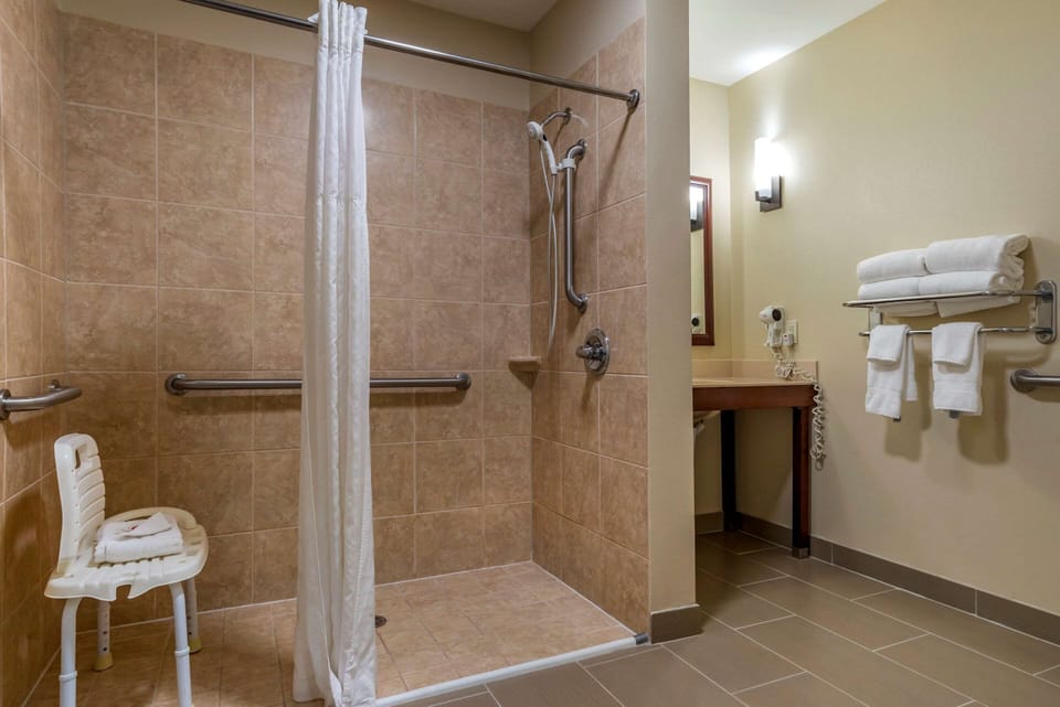 Suite, 1 King Bed with Sofa bed, Accessible, Non Smoking | Bathroom | Bathtub, free toiletries, hair dryer, towels