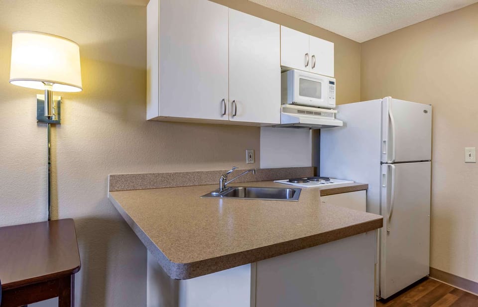 Studio, 1 Queen Bed, Non Smoking | Private kitchen | Full-size fridge, microwave, stovetop, coffee/tea maker