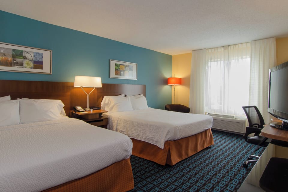 Room, 2 Queen Beds | In-room safe, desk, laptop workspace, blackout drapes