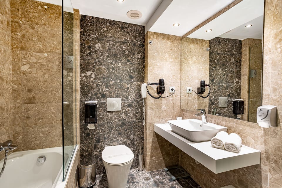 Twin Room, Mountain View | Bathroom | Eco-friendly toiletries, hair dryer, slippers, towels