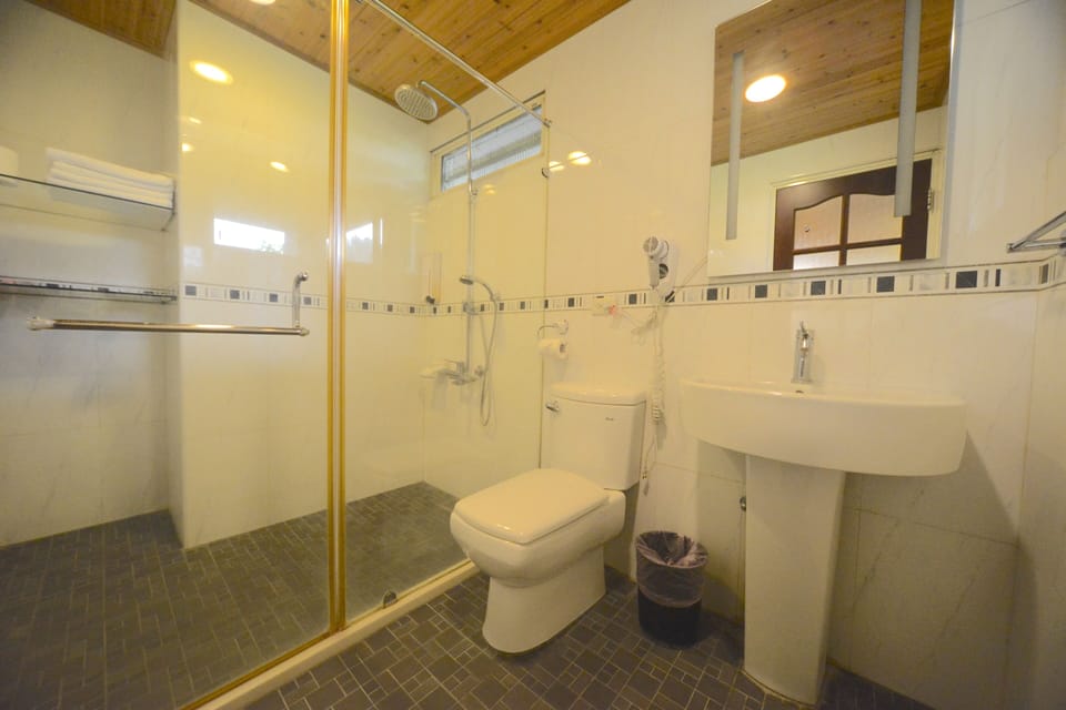 Standard Quadruple Room, Garden View | Bathroom | Shower, free toiletries, hair dryer, slippers
