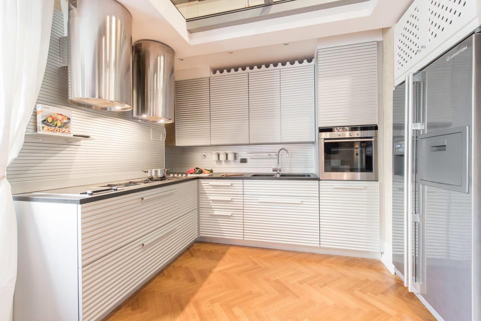 Apartment, 1 Bedroom | Private kitchen | Full-size fridge, stovetop, cookware/dishes/utensils, dining tables