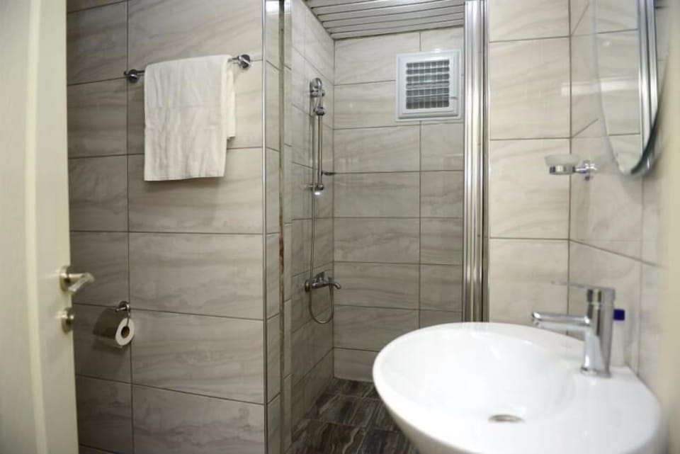 Shower, free toiletries, hair dryer, slippers