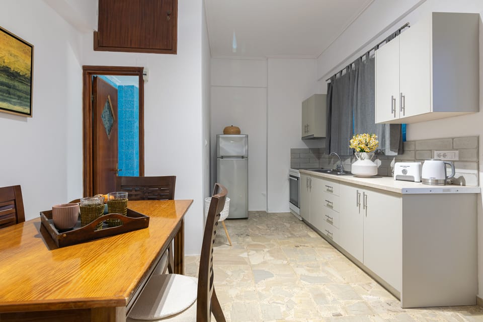 Apartment, 1 Bedroom | Private kitchen | Fridge, electric kettle