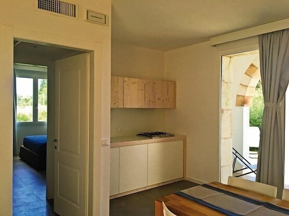 Apartment, 1 Bedroom | Private kitchen | Full-size fridge, stovetop, dishwasher, cookware/dishes/utensils