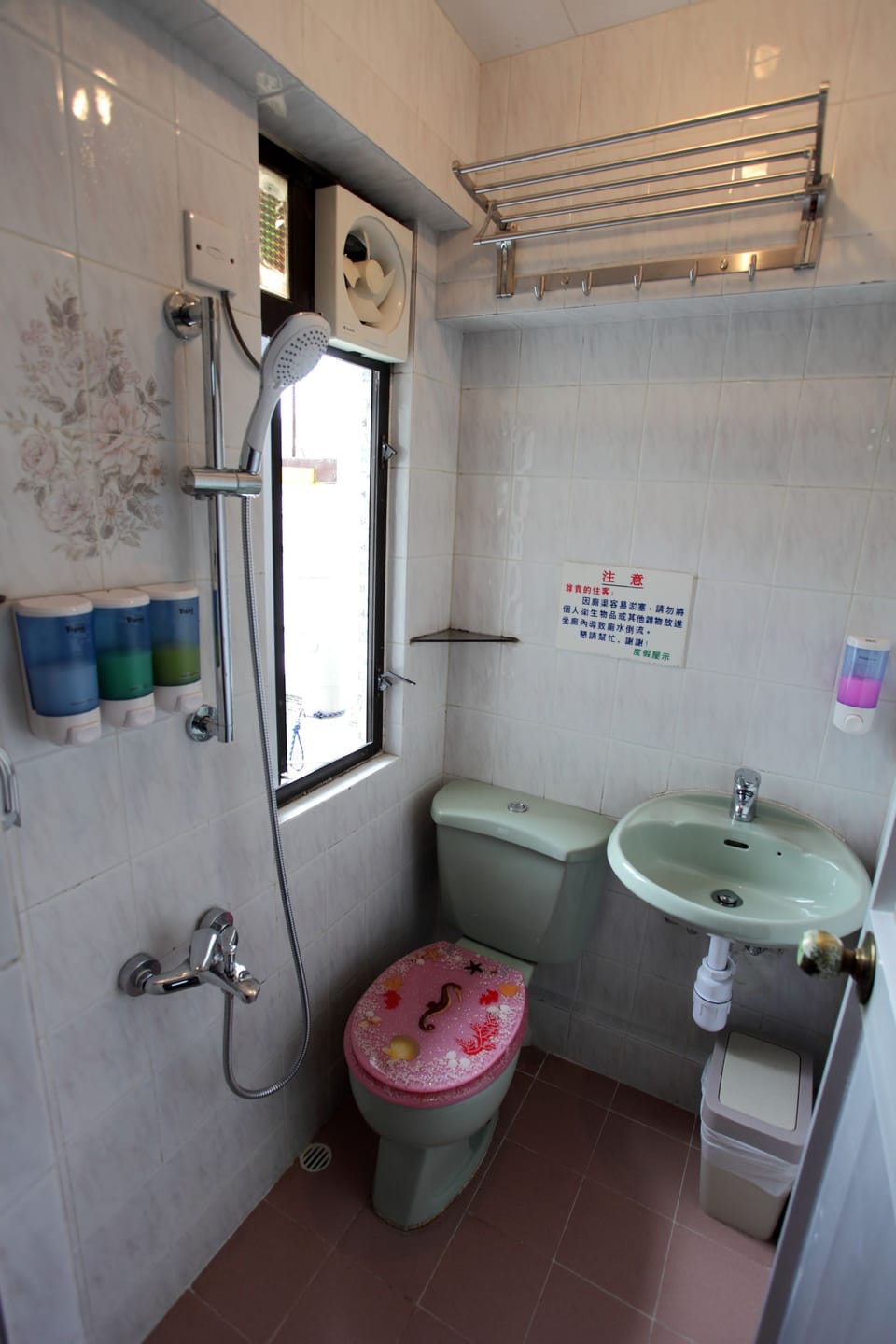 Shower, hair dryer, slippers, towels