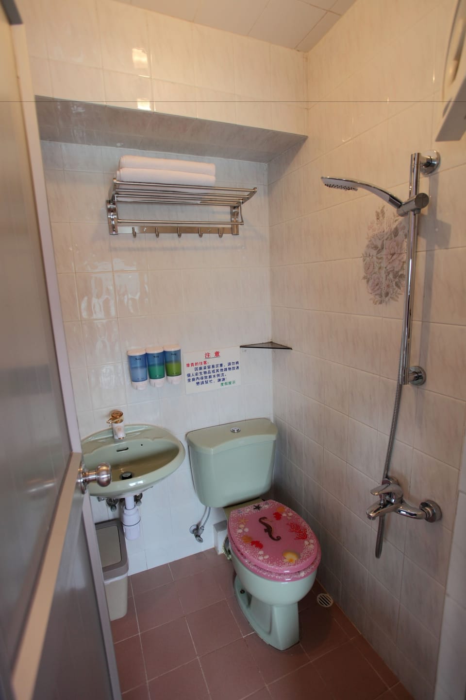 Shower, hair dryer, slippers, towels