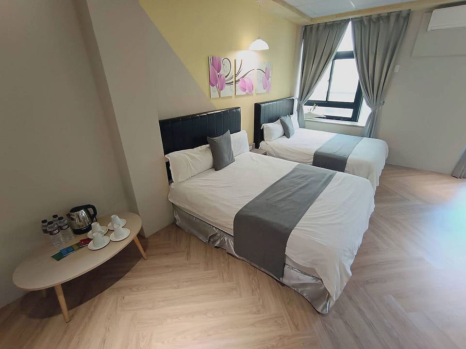 Standard Quadruple Room | Desk, blackout drapes, free WiFi, bed sheets