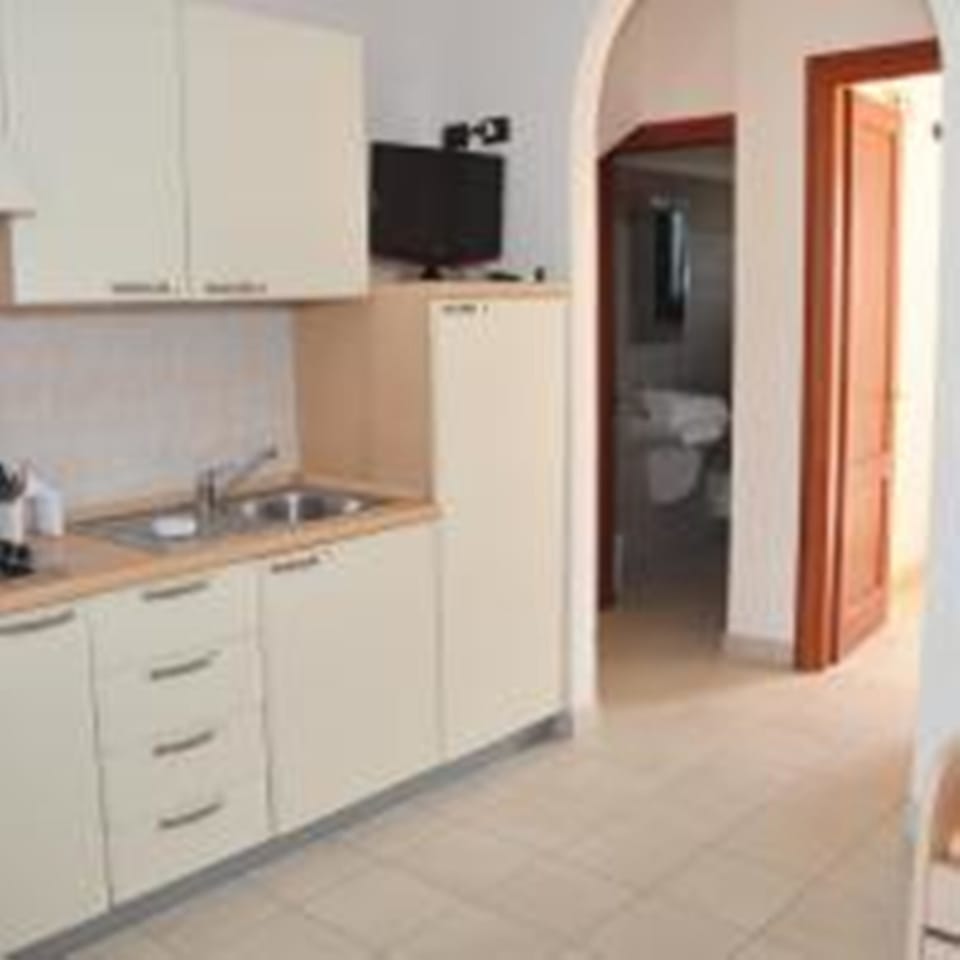 Mini-fridge, stovetop, cookware/dishes/utensils