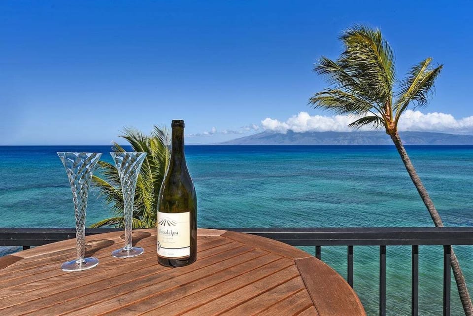 Enjoy sunset cocktails on your private balcony with panoramic views and a refreshing ocean breeze