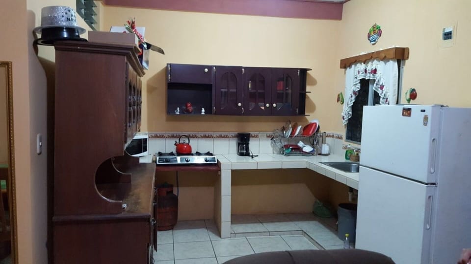 Fully equipped kitchenette with all appliances, kitchenwear and pans