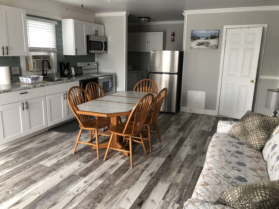 Beautiful vinyl flooring in living room and kitchen.