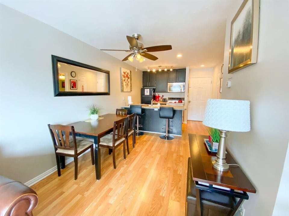 Bright dining area flowing into fully equipped kitchen