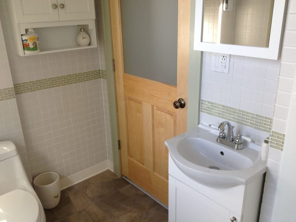 tiled bathroom, native maple door with frosted glass