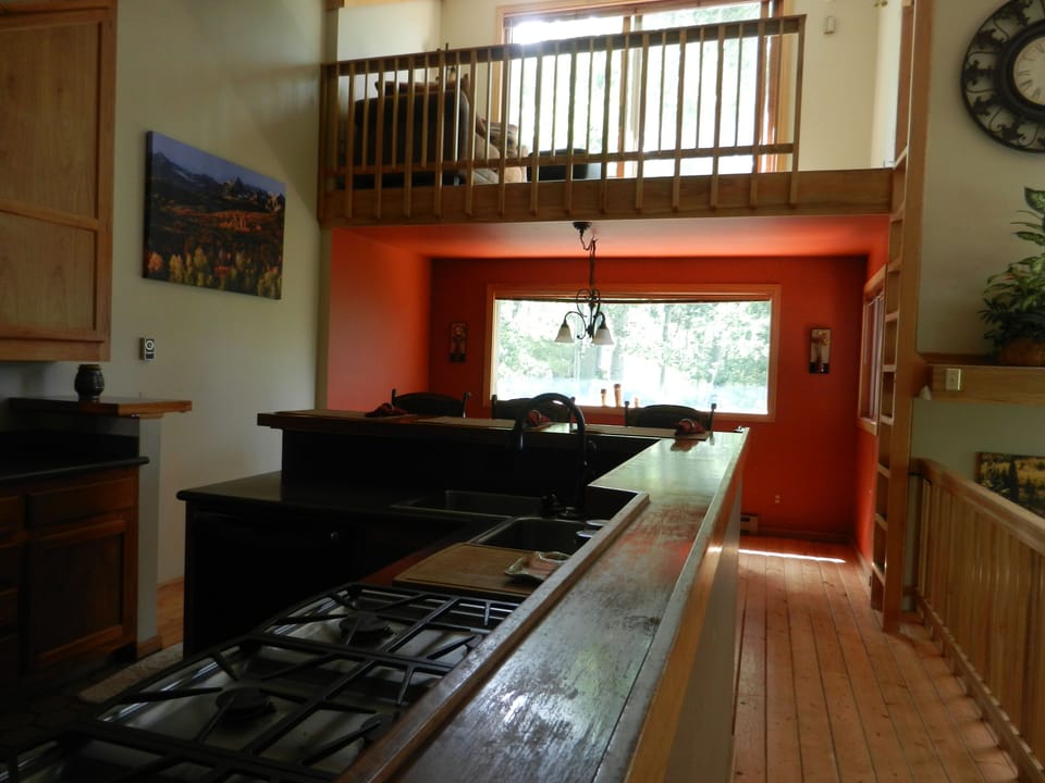 Kitchen, dining room and upper loft.