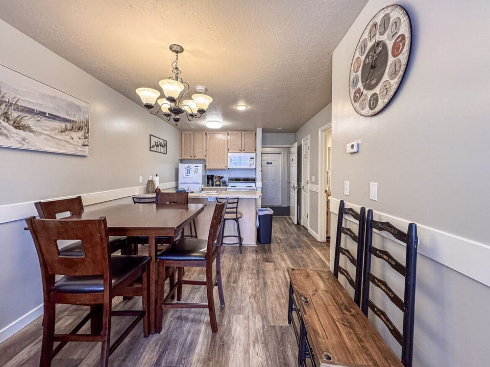 Charming dining area with seating for six and a warm, inviting flow into the kitchen.