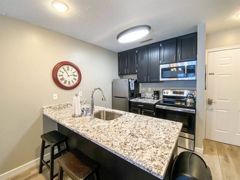 Fully equipped kitchen with sleek appliances and island seating