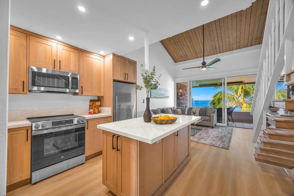A beautiful, fully-equipped kitchen with an open design that connects seamlessly to the living area and ocean view. Prepare meals with a view!