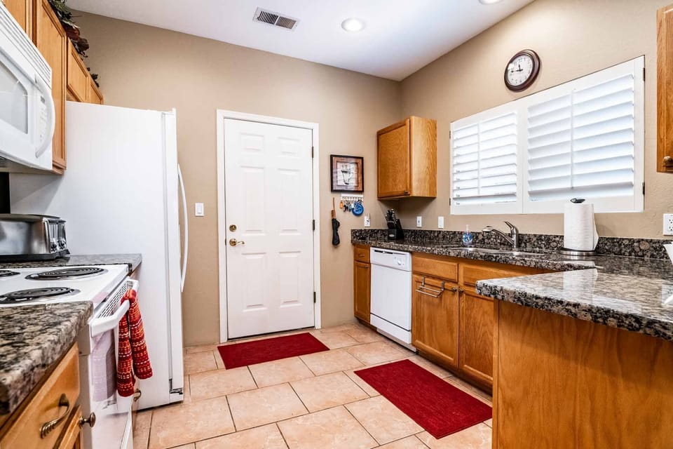 Kitchen w/ door leading into garage