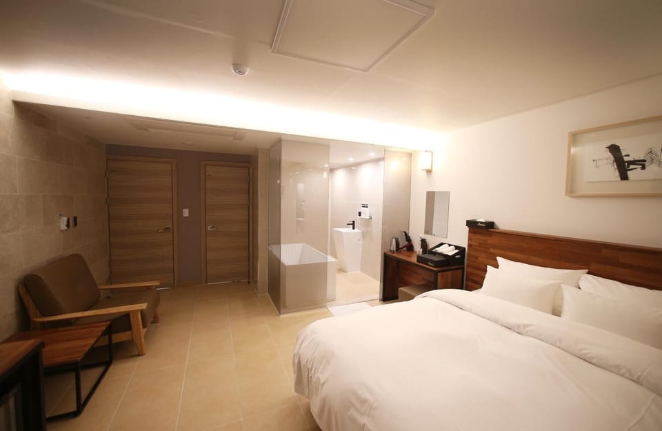 Premium bedding, down comforters, desk, laptop workspace