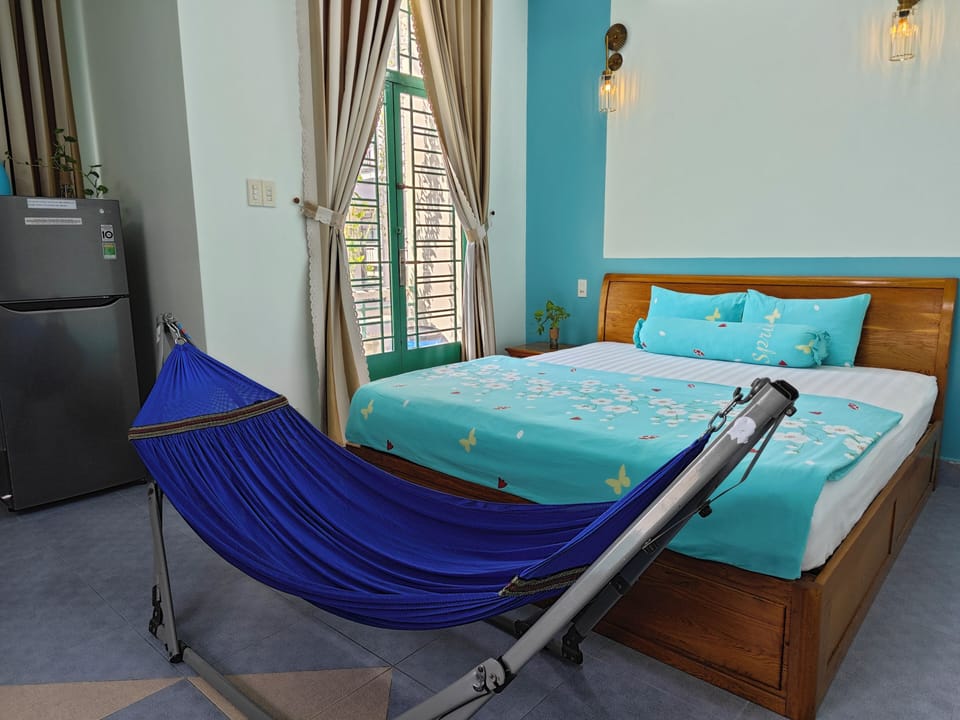 Family Triple Room, 1 Bedroom, Balcony | Free minibar, individually decorated, desk, free WiFi