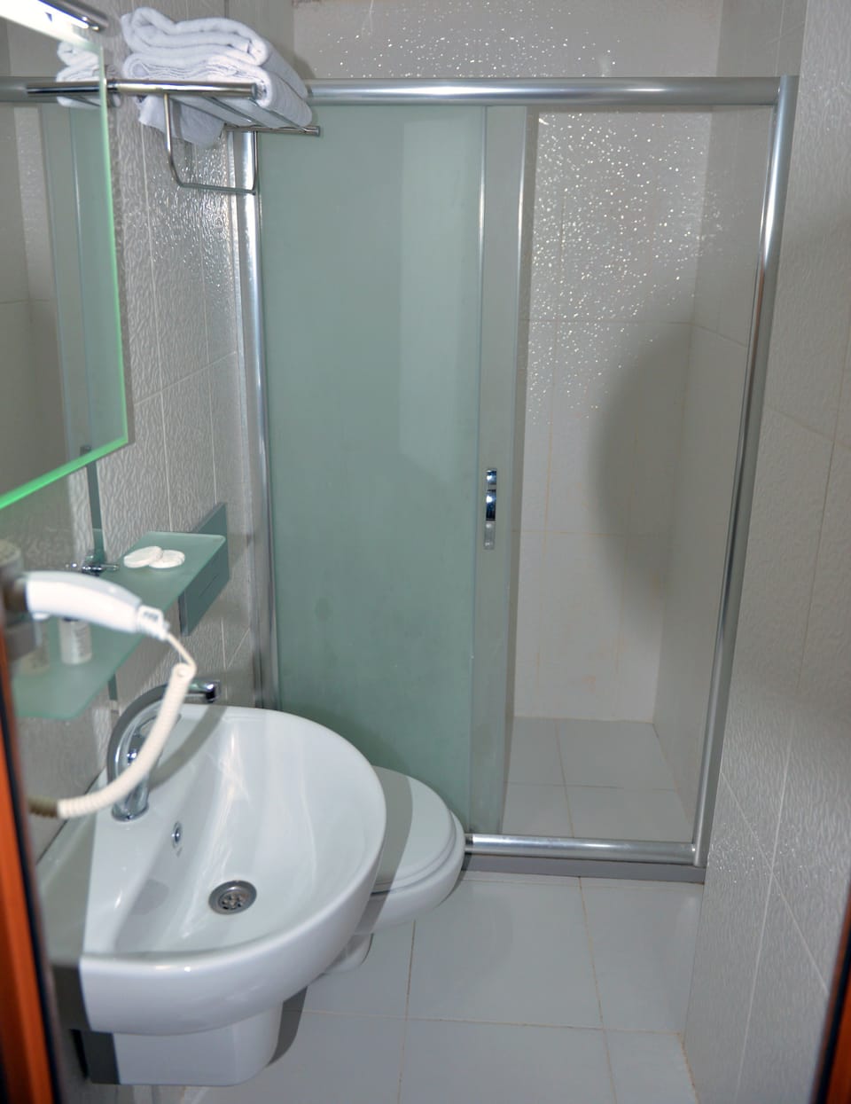 Shower, hair dryer, slippers, towels