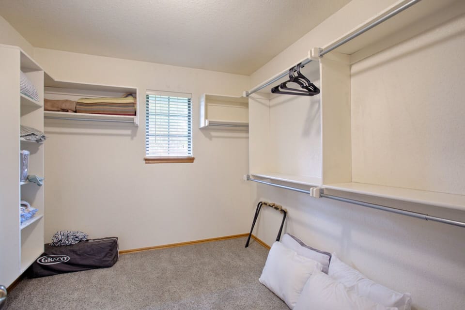 Master closet where you can find extra pillows, sheets, blankets and pack n play