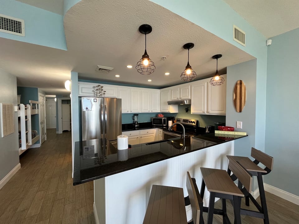 Fully equipped kitchen with modern appliances—perfect for whipping up a beachside breakfast.