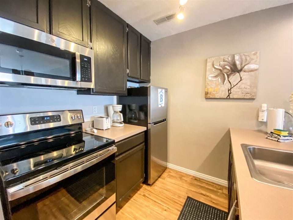 Fully equipped kitchen with stainless appliances and modern finishes