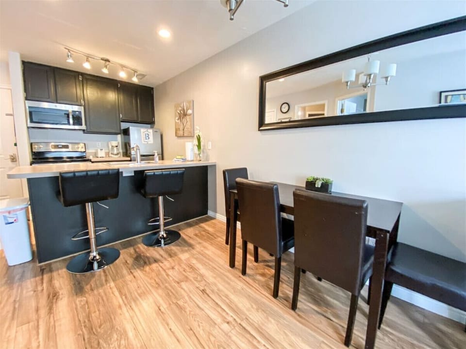 Open dining space with bar seating and kitchen access