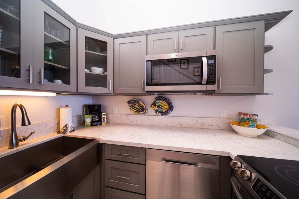 Modern kitchen with full-size appliances, ample cabinetry, and generous counter space.