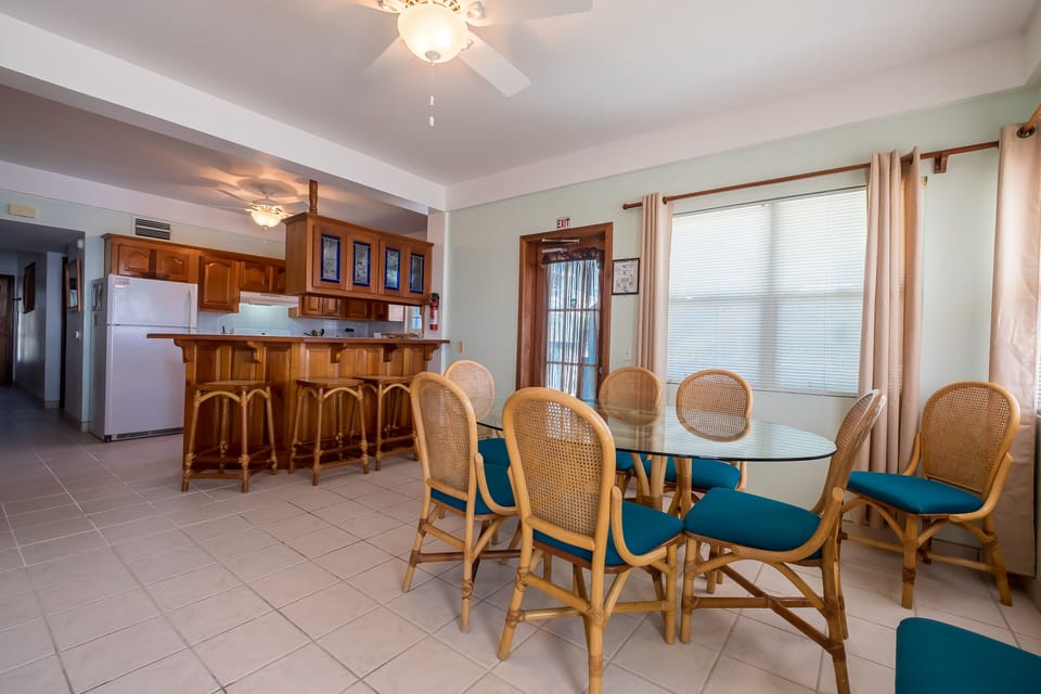 Dining room with seating for 7.  Extra seats at bar.