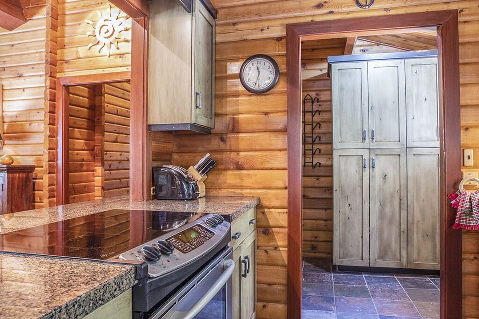 Kitchen - Glass-top stove, dishwasher, drip coffee machine, french door fridge with freezer bin, microwave, and plenty of kitchen tools to cook your meals.