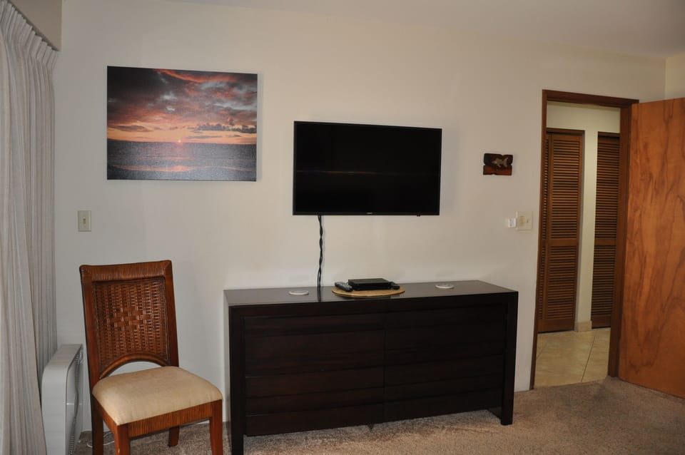 New Samsung Smart TV mounted on bedroom wall
