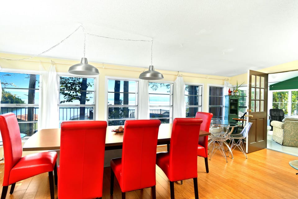 Dining area, two tables, nine chairs and a bench