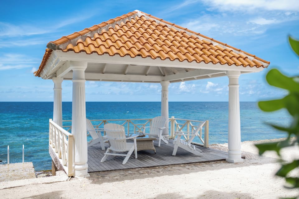 Gazebo at the beach with access to the ocean with swimming stairs on the left