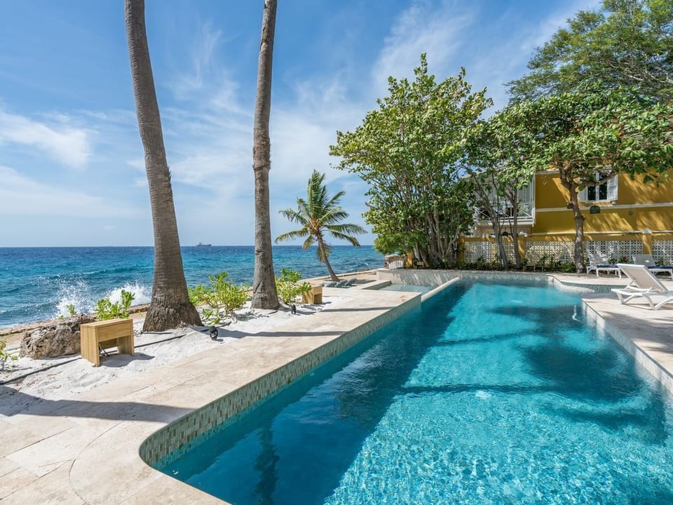 Large part of the swimming pool and private beach