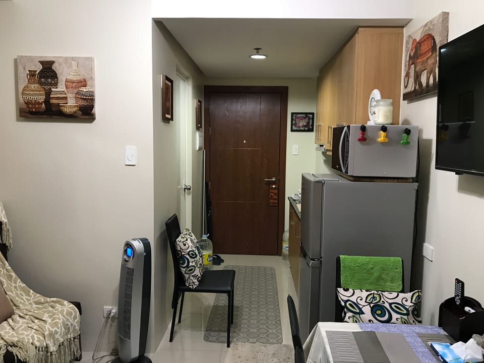 Two-door refrigerator, microwave oven,Two top burners, blender, kitchen utensils