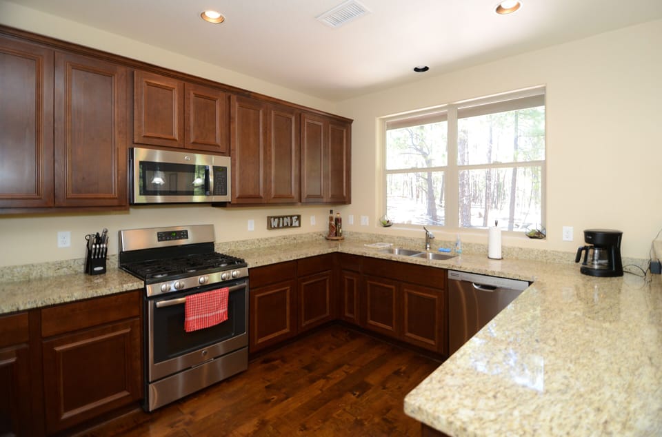 New stainless steel appliances with gas range and French door fridge. 