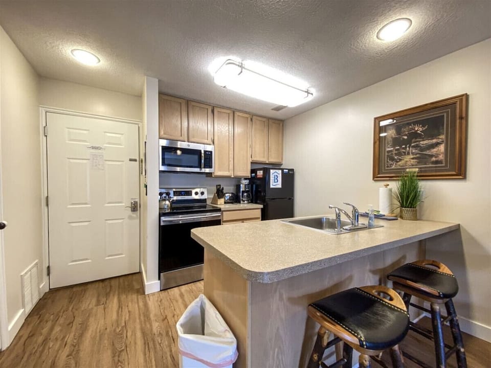 Modern kitchen with bar seating—perfect for morning coffee or casual evening conversations.