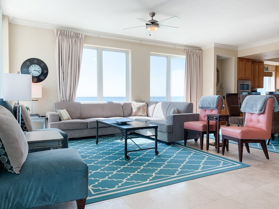 Beautiful & comfortable family room with windows filling two walls. Those views!