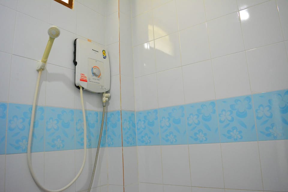 Air Conditioned Room | Bathroom | Shower, free toiletries, hair dryer, towels