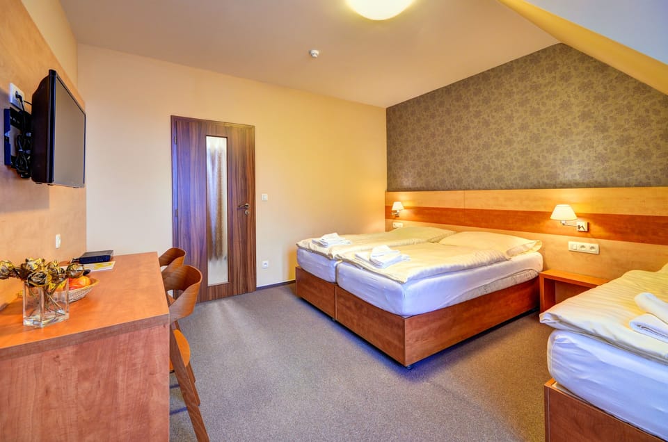 Standard Triple Room | Desk, laptop workspace, blackout drapes, soundproofing