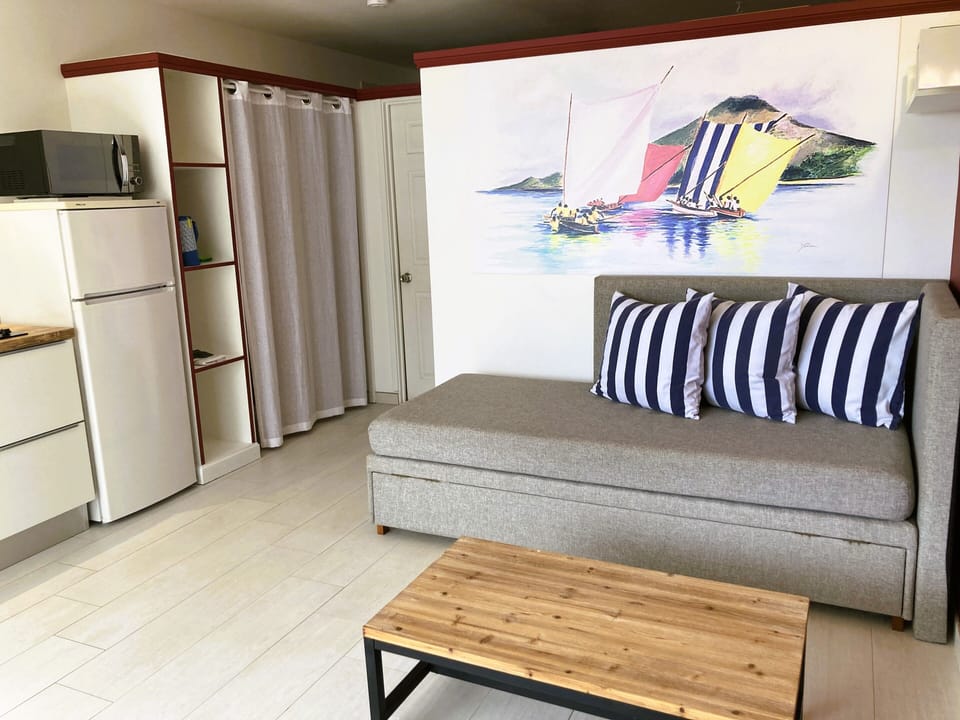 Panoramic Apartment, 1 Bedroom, Terrace, Bay View | Living area | 32-inch flat-screen TV with satellite channels, TV, toys