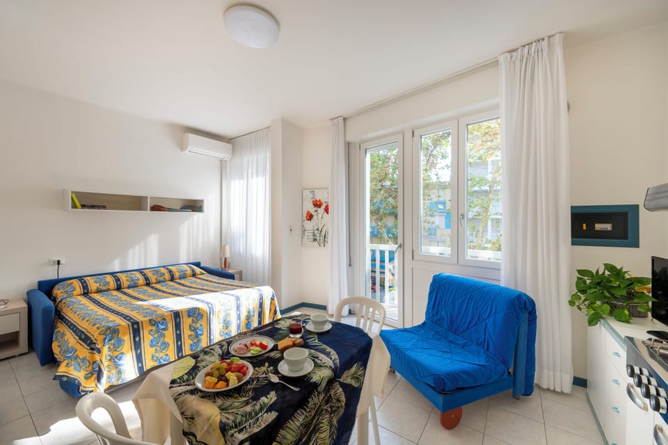 Standard Studio, Balcony | Living area | Flat-screen TV