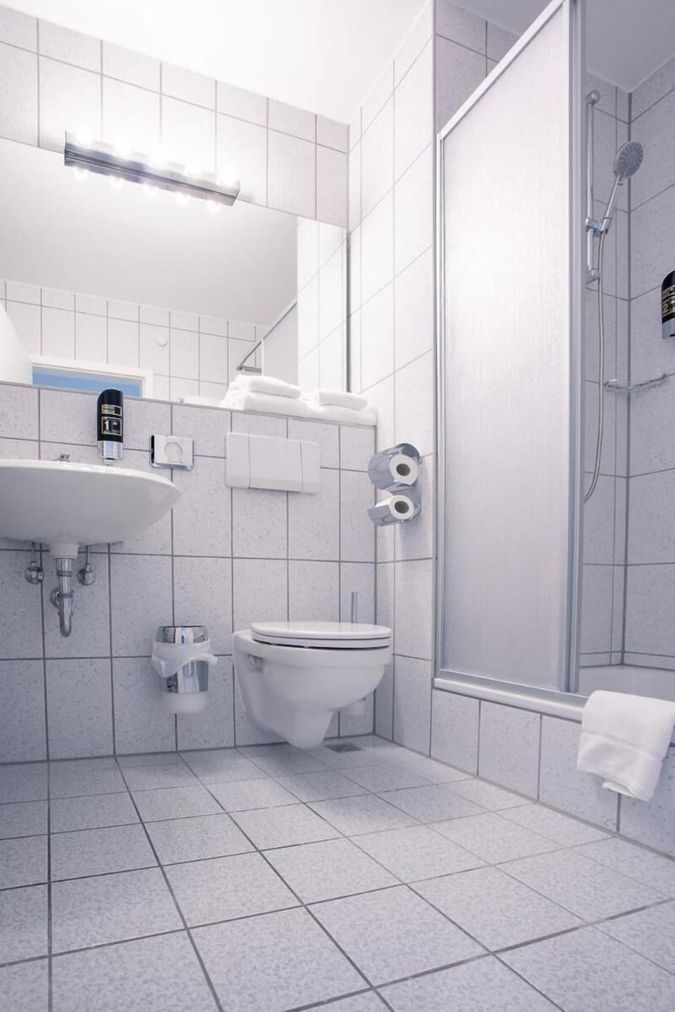 Shower, free toiletries, hair dryer, towels