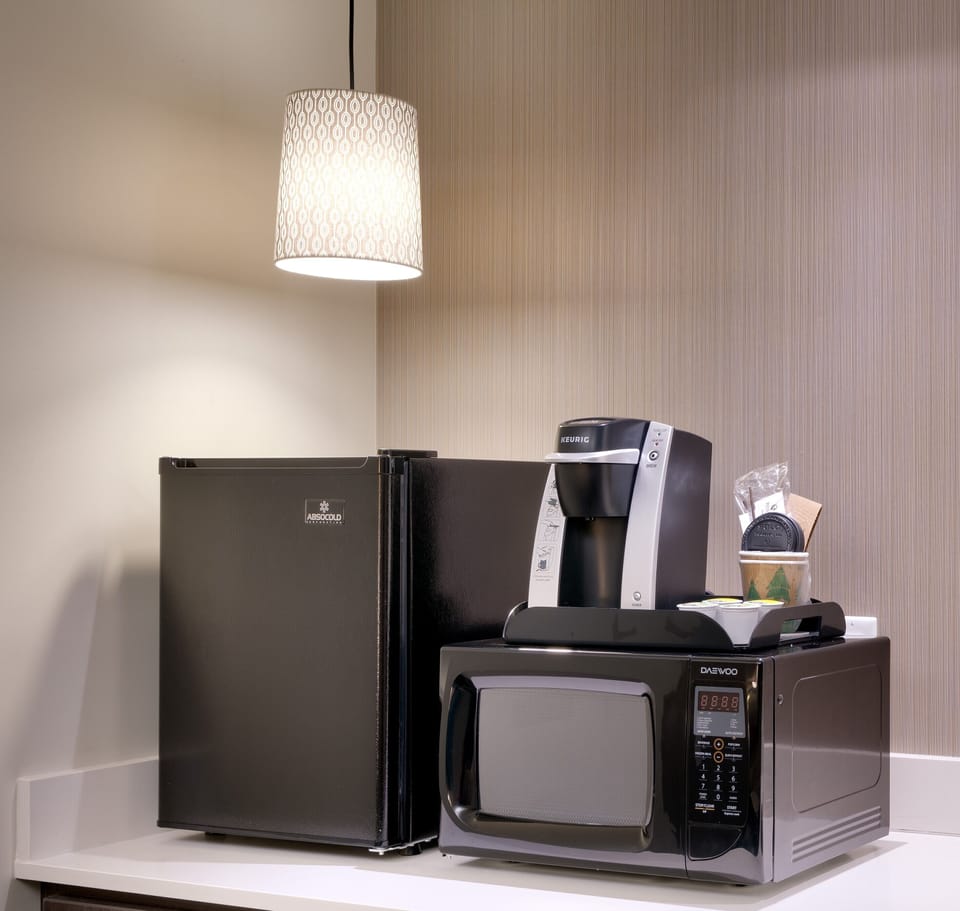 Premium bedding, desk, laptop workspace, iron/ironing board