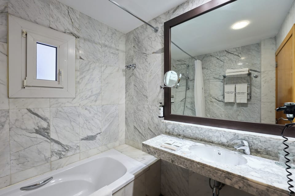 Eco-friendly toiletries, hair dryer, towels