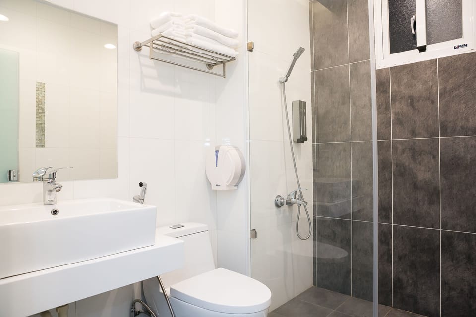 Hair dryer, slippers, bidet, towels