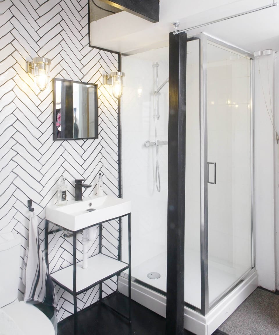 Rainfall showerhead, designer toiletries, hair dryer, towels